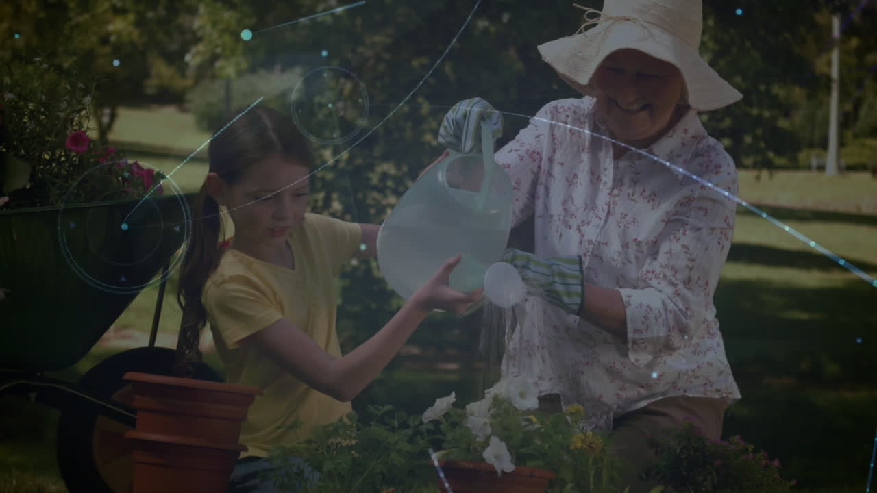 함께 식물에 물을 주고, 소녀와 노인 여성이 온라인 비디오 통화를 통해 정원 가꾸고 있습니다.