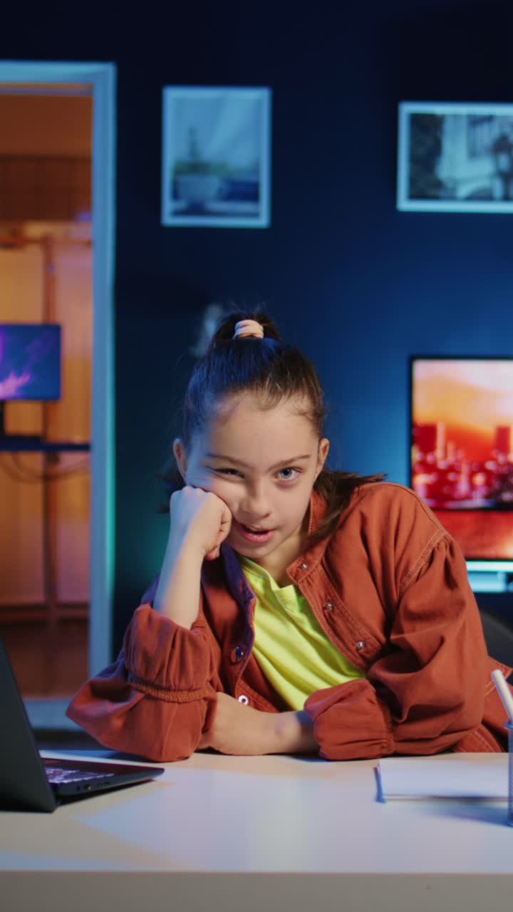 Vertical video Kid captures footage with mobile phone, discussing topics, close up