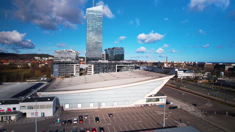 Aerial-backwards-shot-luxury-buildings-in-Przymorze-district-in-Gdansk-during-sunny-day