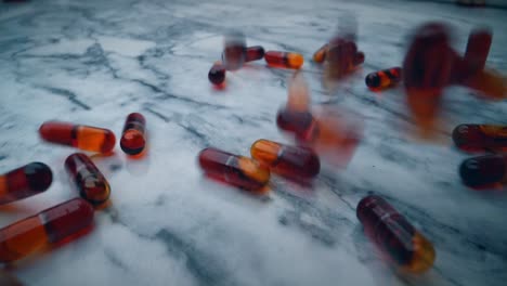 Red-krill-oil-capsules-falling-on-to-a-white-marble-table-from-above