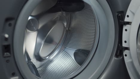 close up of empty drum of modern washing machine