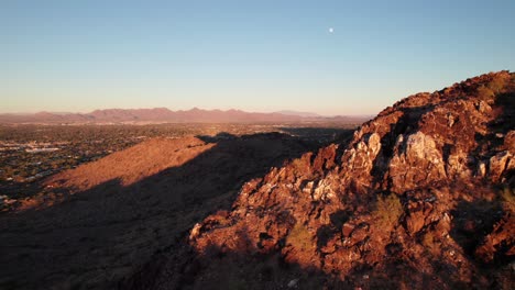 rugged mountainous landscape outside phoenix, arizona. rich red desert, sunset aerial, 4k