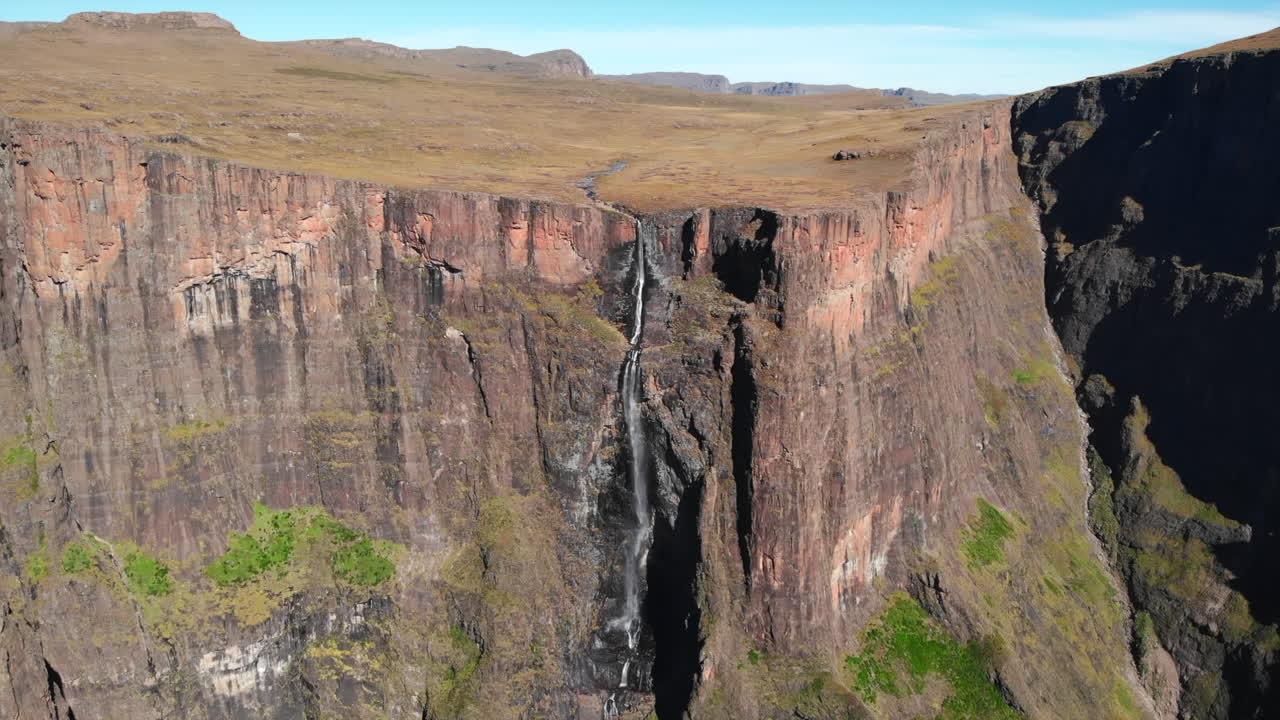 Scenic Waterfall Cascading Down a Cliff