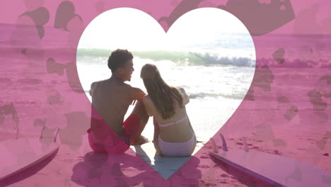 animation of heart cut out over diverse couple in love on beach in summer