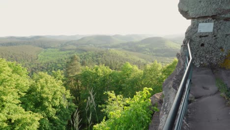 first person pov walking along metal rail trail looking out to mountain expanse