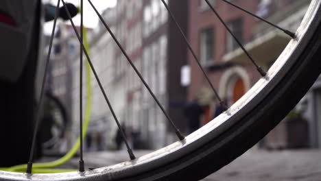 electric car charging on background a bicycle wheel in amsterdam