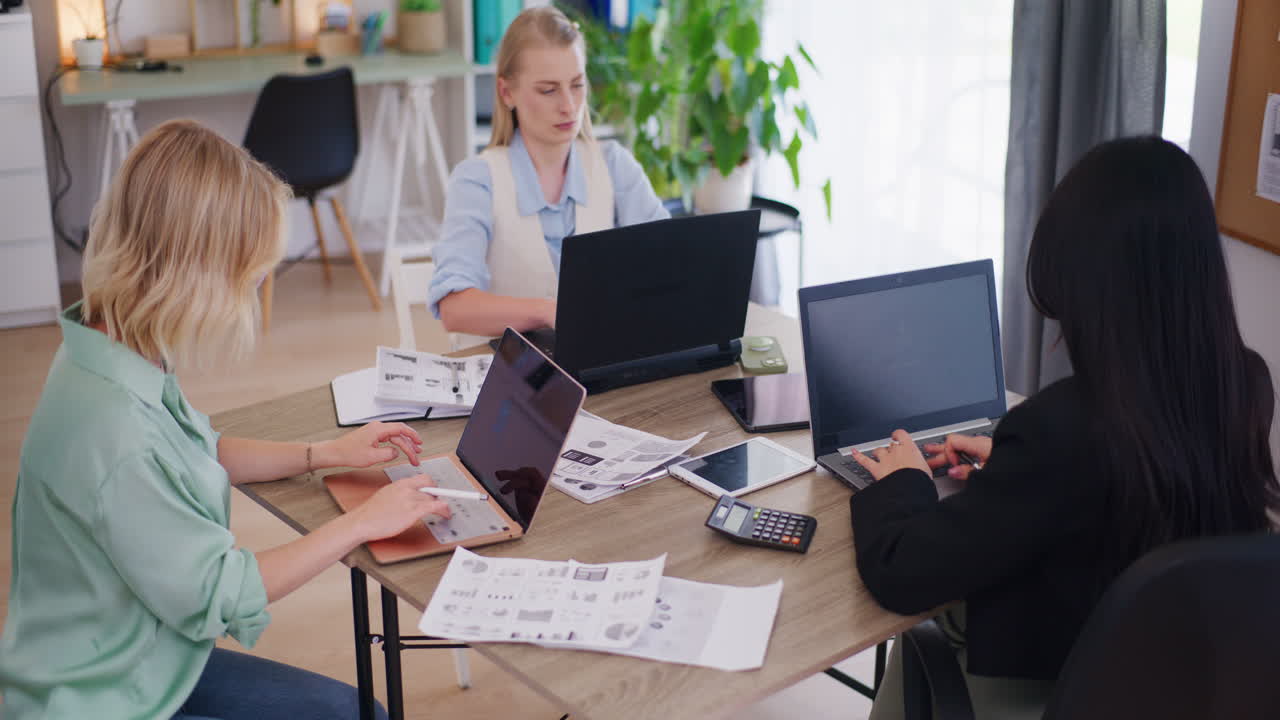Three Women Working in Office