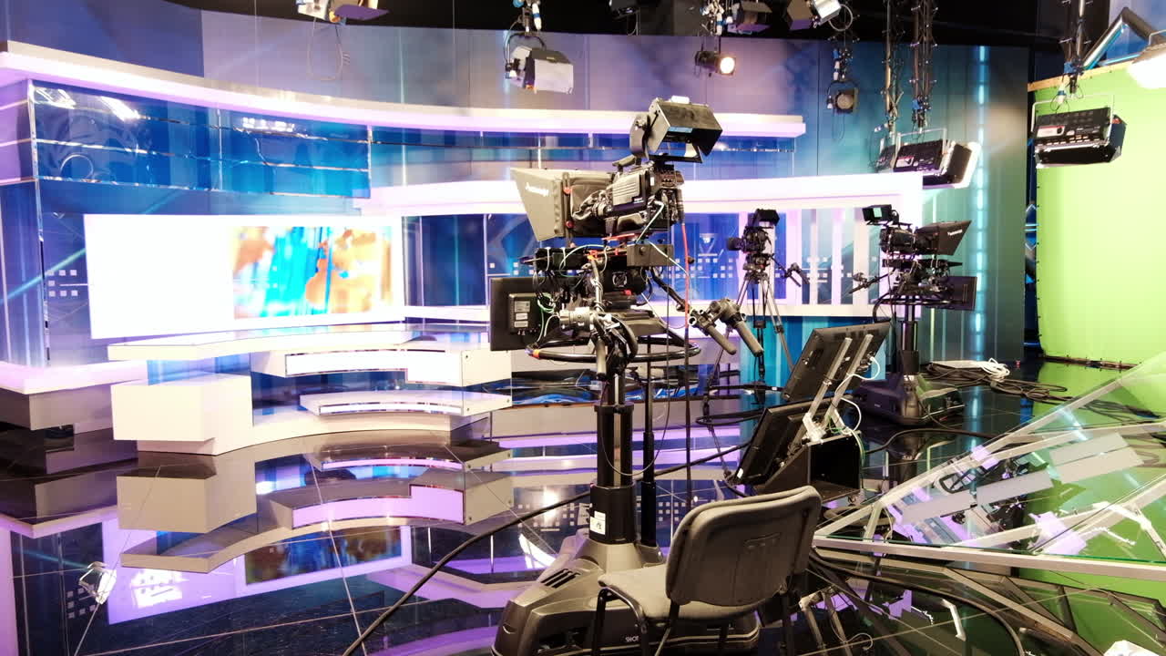 CHISINAU, MOLDOVA - 10 SEPTEMBER, 2019: Professional tv station set with screens and recording cameras and lights