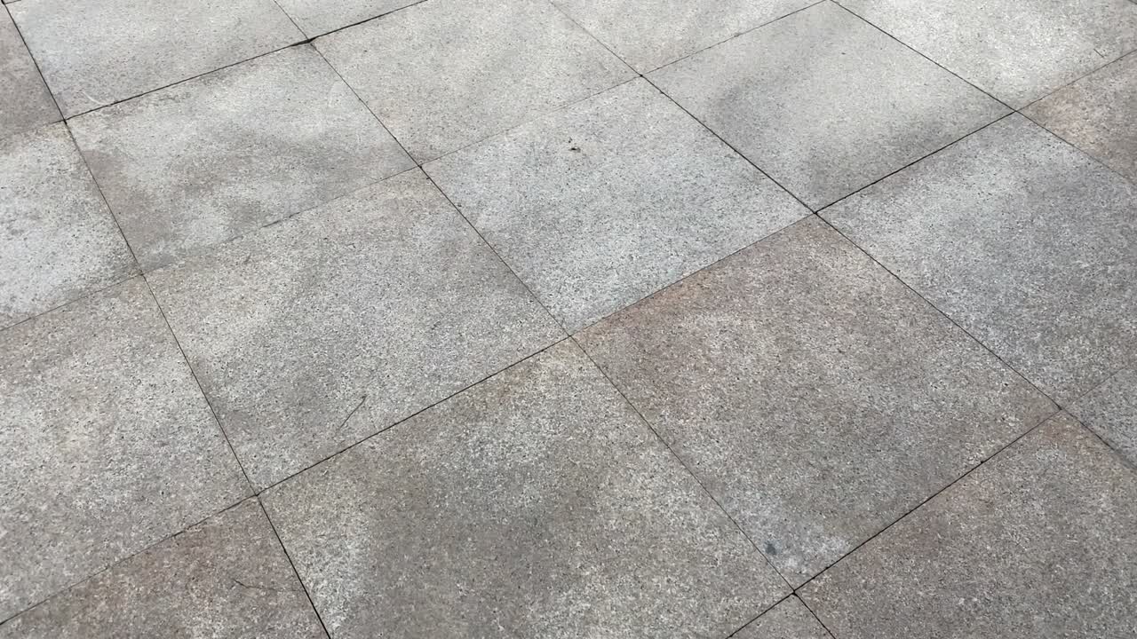 Walking on concrete floor in rainy weather.