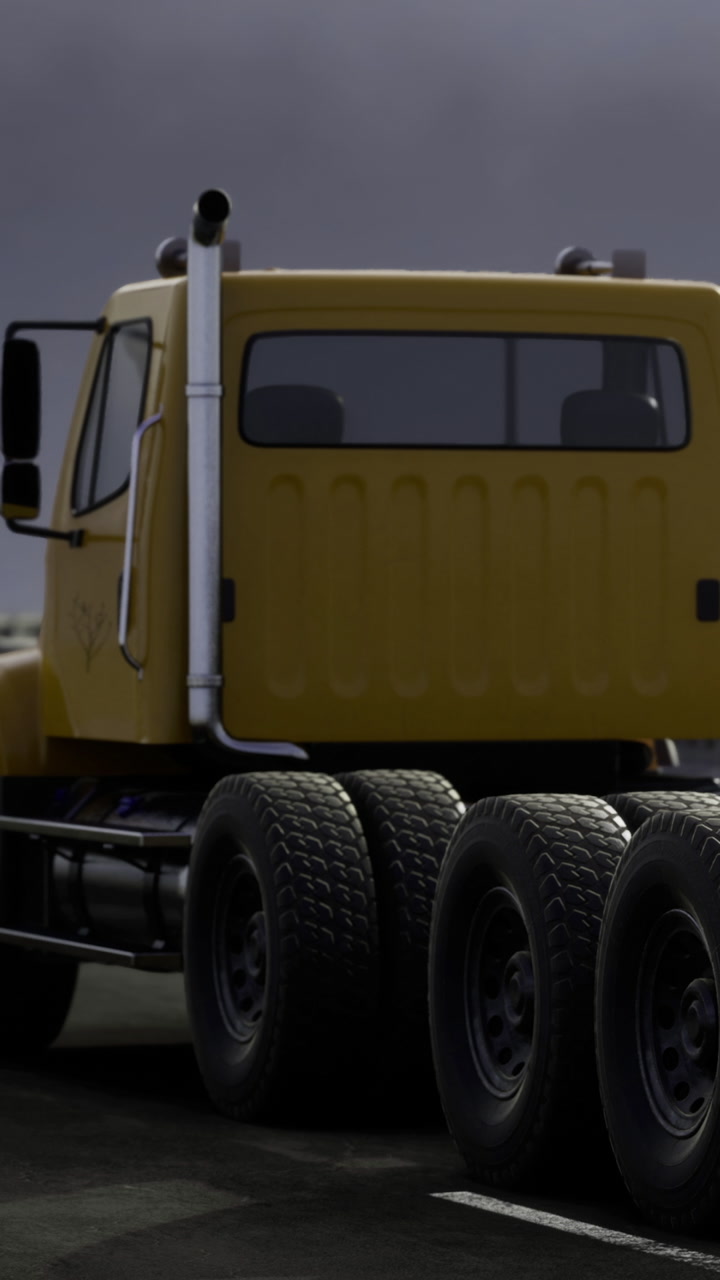Truck parked on a street under overcast sky during late afternoon hours