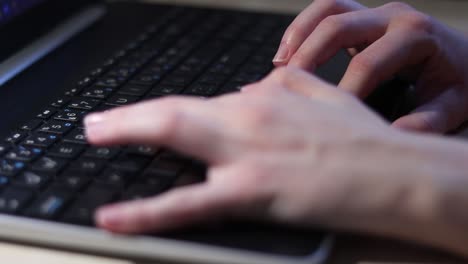 Clos-up-of-the-girls-hand-which-is-softly-typing-on-the-laptop-keyboard