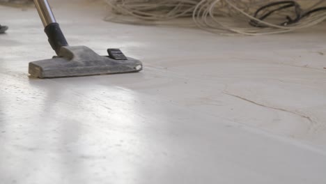 cleaning a construction site floor with a vacuum