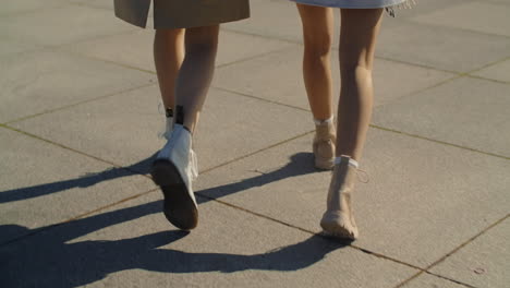 women walking on a city street