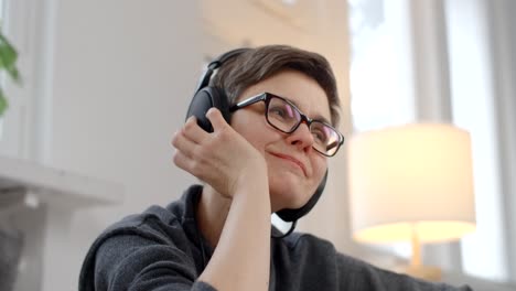 woman listening to music at home