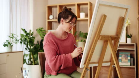 woman painting at home