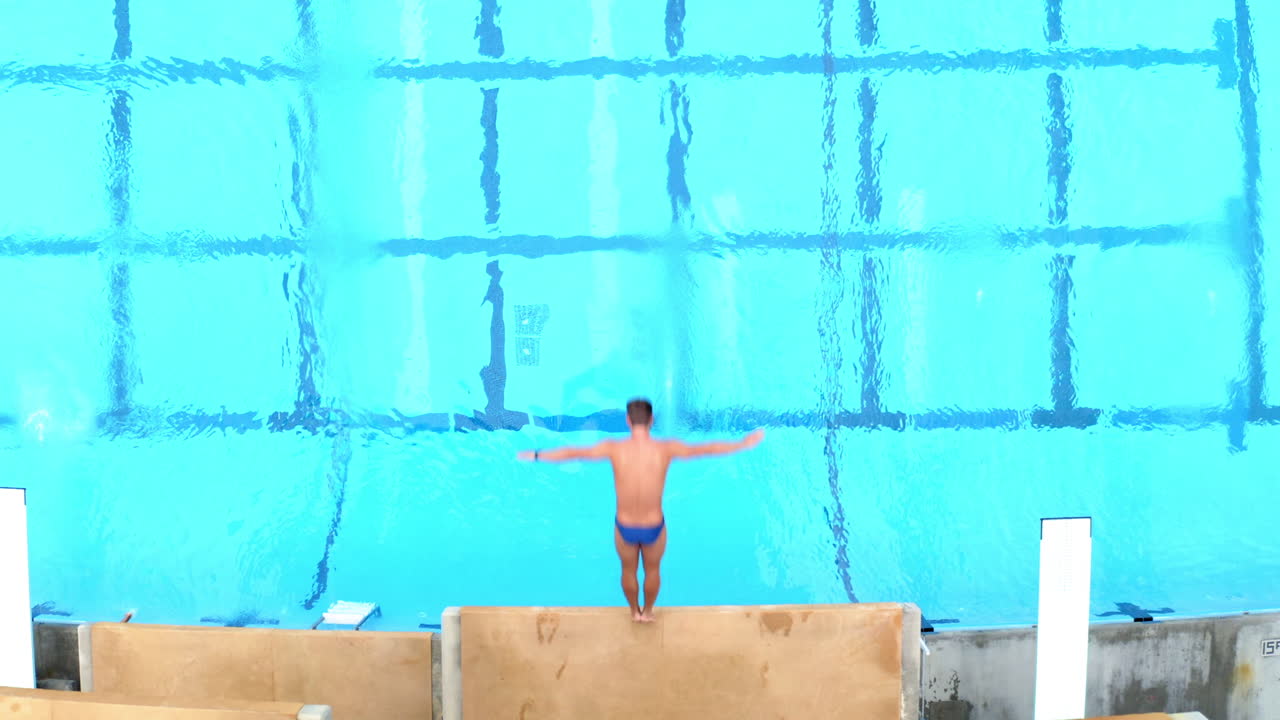 A sequence showing a diver jumping into a swimming pool