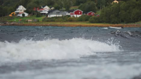 white-crested waves crush on the shore