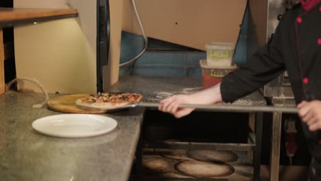 pizza chef preparing pizza in a restaurant