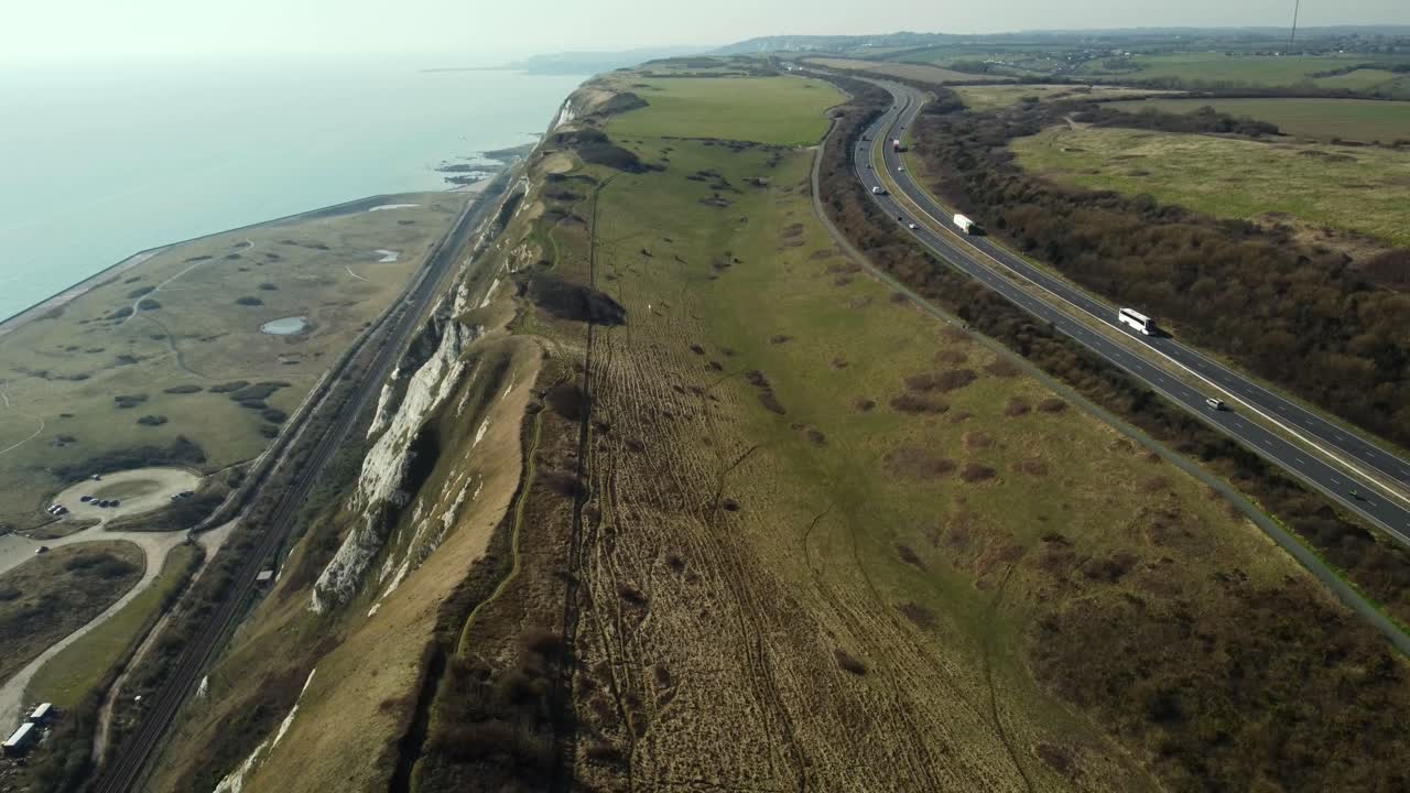 Aerial view of coastline with highway and railroad