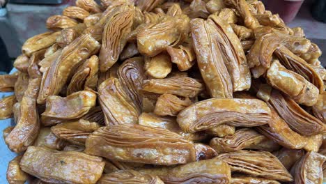 khaja an odisha based sweet dipped in sweet syrup of gur. closeup shot.