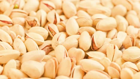 looped rotating pistachios full frame close-up background