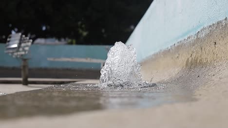 front view of jets of water from city fountain in park