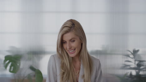 portrait attractive young blonde business woman smiling happy looking shy feminine intern wearing stylish corporate fashion in office background