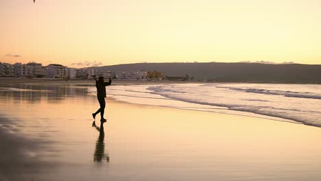 silhouette of a fisherman fishing with a fishing rod