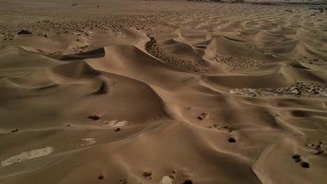 a cinematic drone capturing detailed close-up shots of the sand dunes in death valley national park