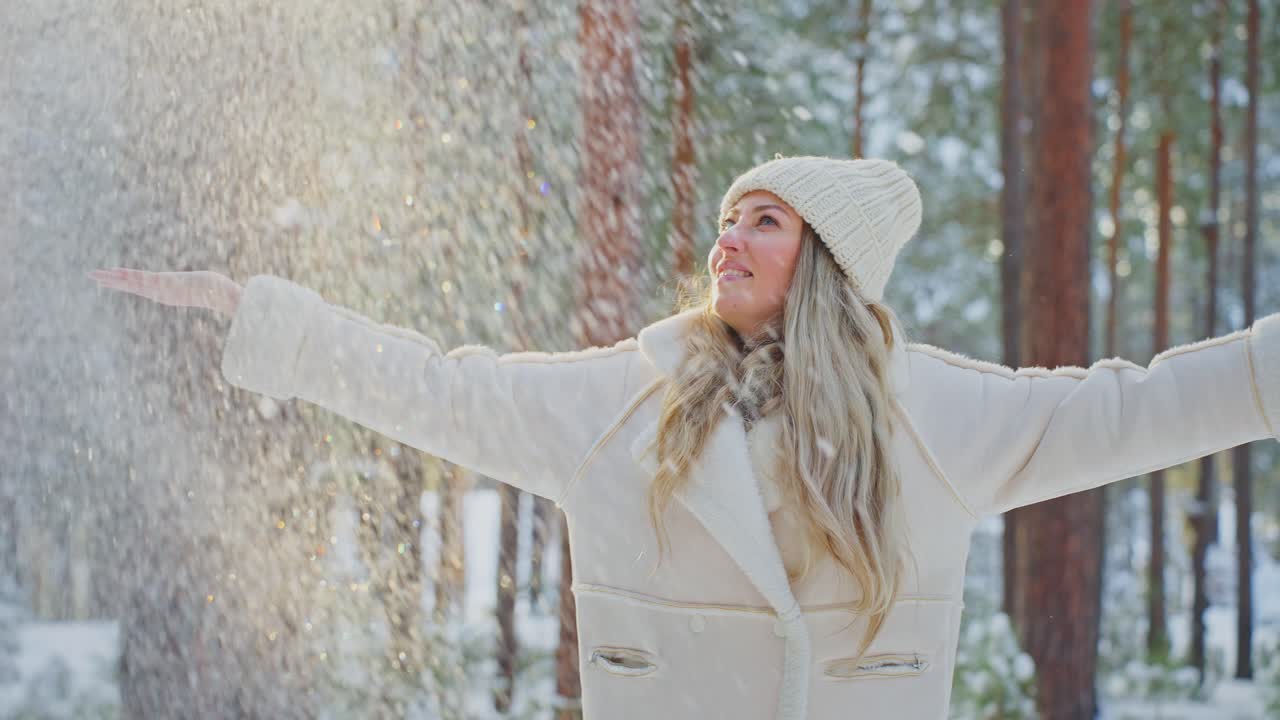 Woman enjoying a snowy winter day in the forest