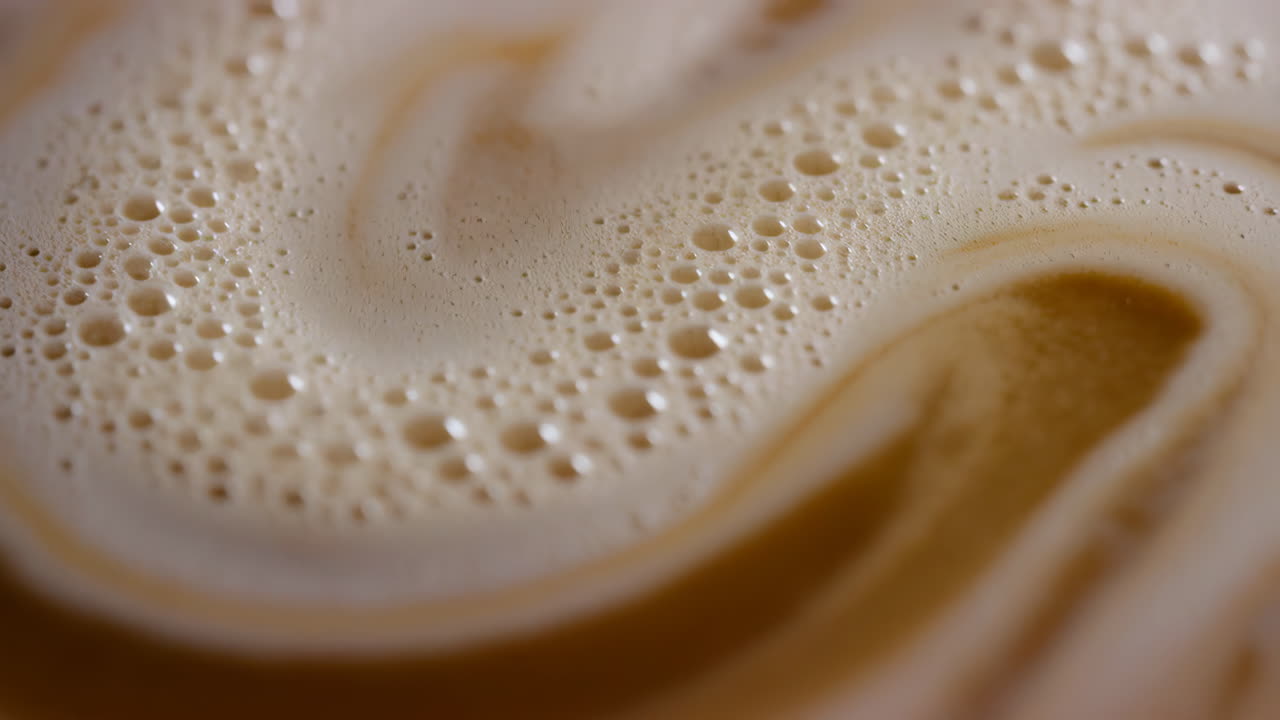 Close-up of Creamy Coffee Foam Swirl