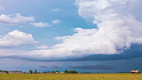 white clouds moving over agricultural fields in countryside