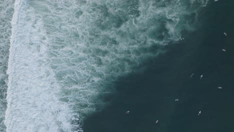 Aerial-Top-Down-Slow-Motion-Drone-View-Of-Surfers-La-Bocana-El-Tunco-El-Salvador