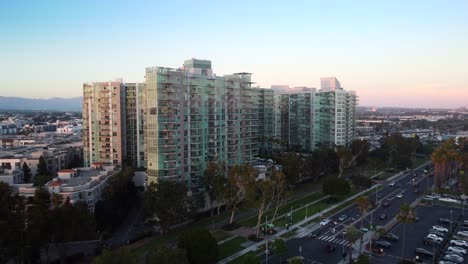 drone shot residential apartment building on skyline of los angeles