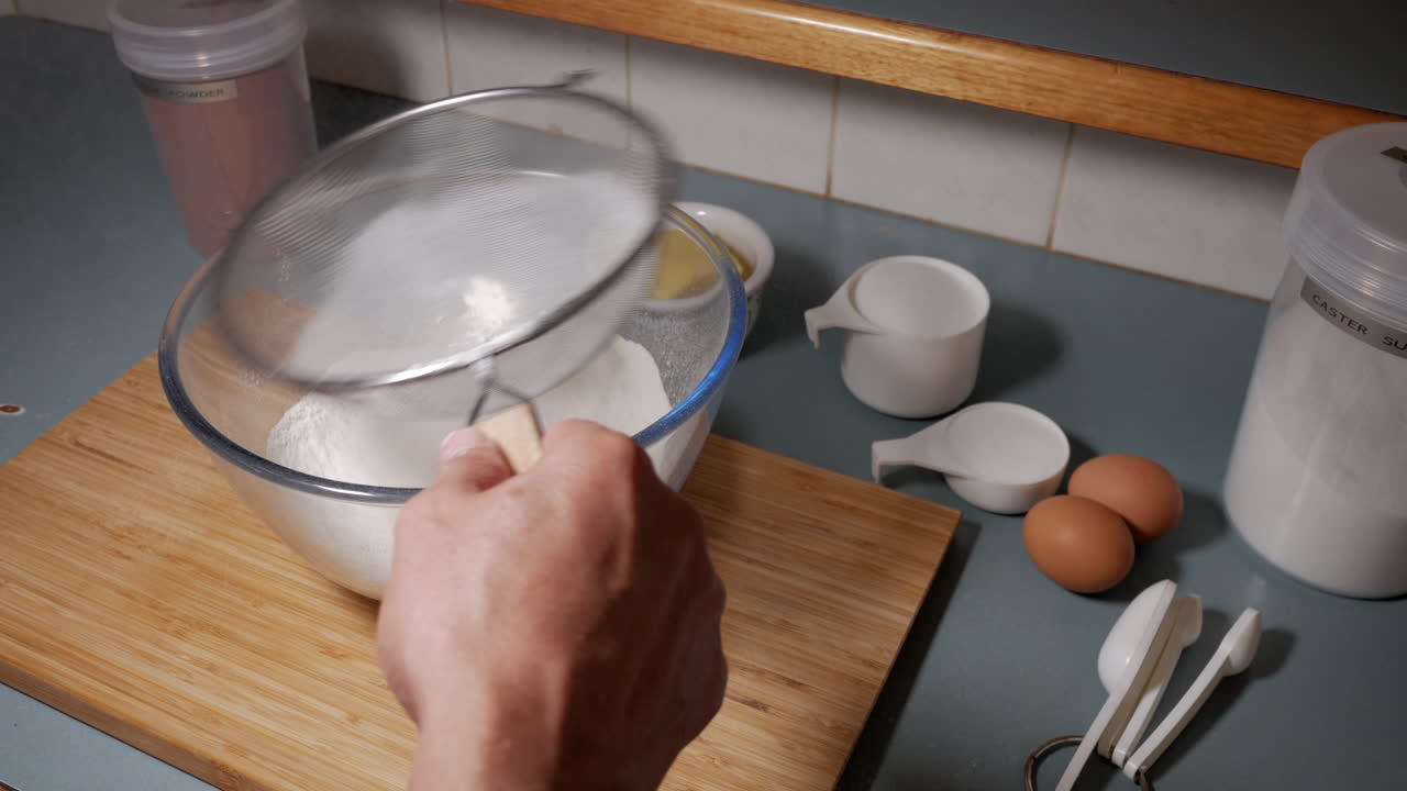 Male preparing a chocolate cake