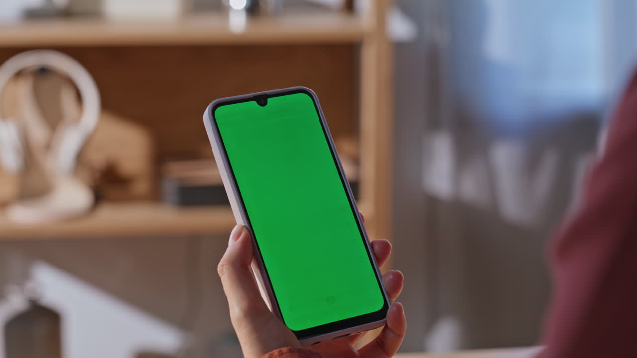 Lady finger touching mockup cellphone at workplace closeup. Woman holding device