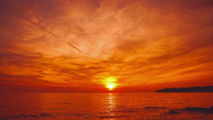 A beautiful and romantic sunset at a beach in Croatia, captured as a time-lapse