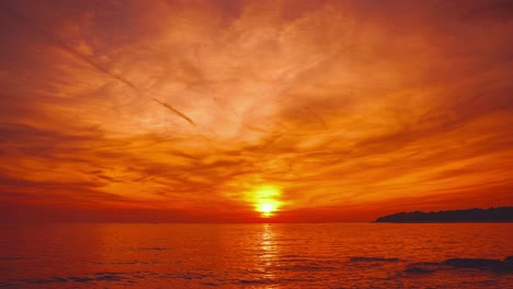 a beautiful and romantic sunset at a beach in croatia, captured as a time-lapse