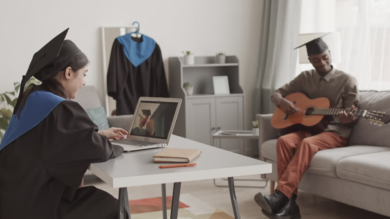 Graduates Having Graduation Ceremony at Home