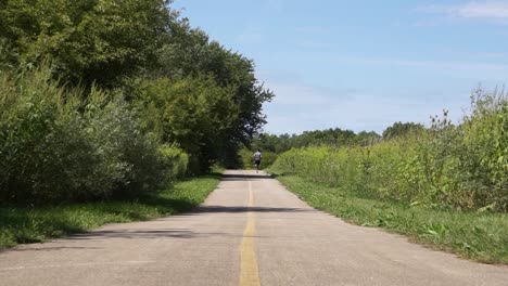 young runner training on forest preserve trail