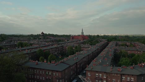 Aerial-View-Of-Red-Brick-Apartments-In-Nikiszowiec,-Katowice,-Poland-With-St