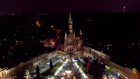 Drone-view-of-Christmas-stalls-and-carousel-on-the-Podgorski-Square-with-St