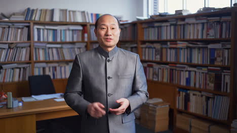 man in a formal suit in a library