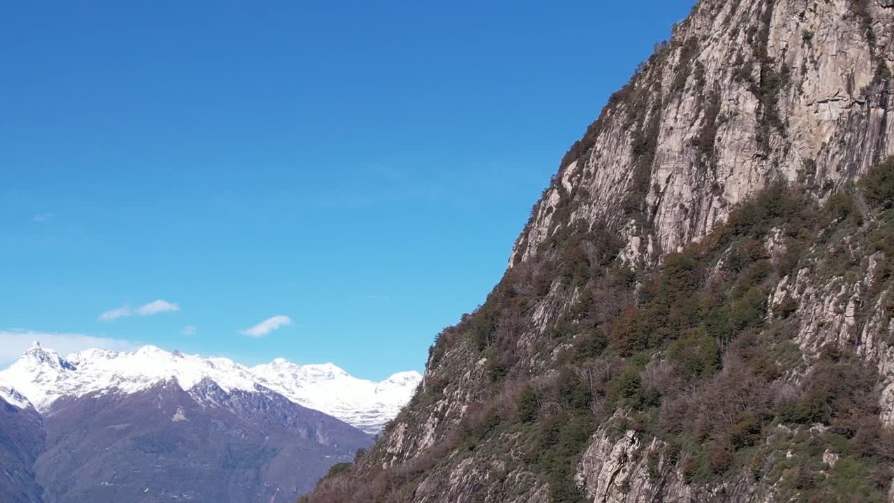 Aerial view of the stunning Italian Alps with cliffs and blue sky