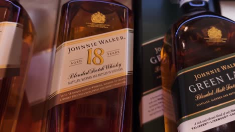 johnnie walker and green label scotch whisky bottles