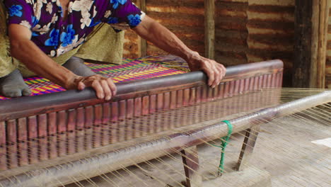 Skilled-artisans-in-Quang-Nam,-Vietnam-handcraft-mattresses-using-traditional-techniques-and-natural-materials