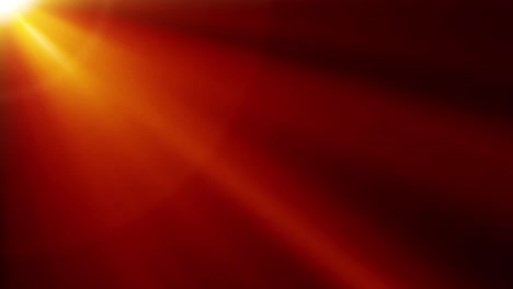rays of orange light from the top left. side diagonal light optical lens flares shiny animation art background 4 k loop. lighting sun rays simulation effect.
