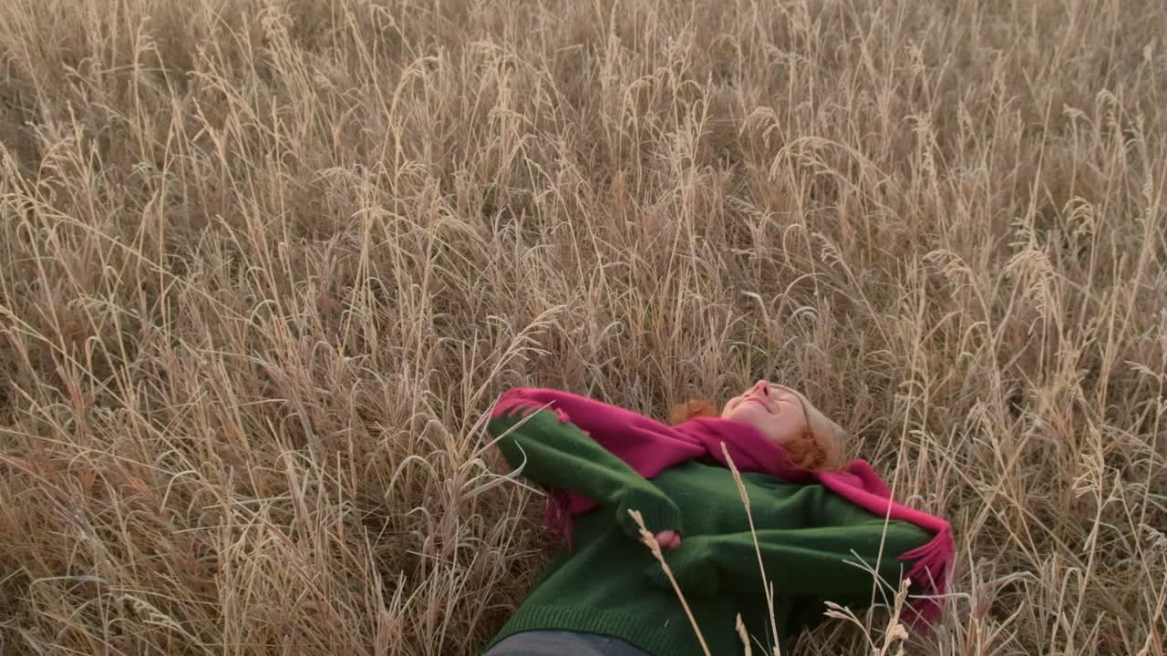 Woman relaxing in a field