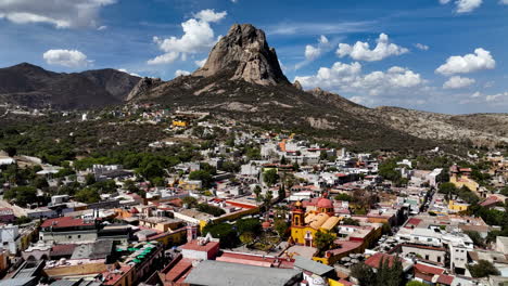 monolith peak with the bernal village in the foreground, in mexico - aerial view