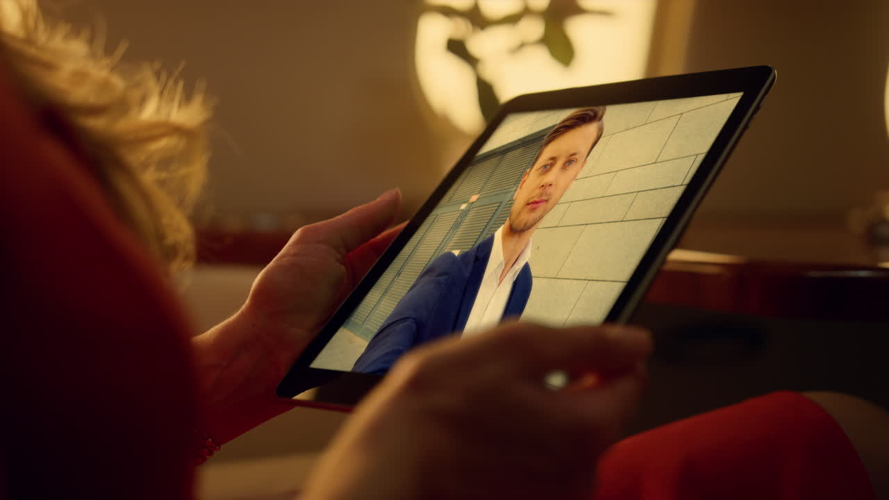 Business lady calling online to man manager by tablet at evening office close up